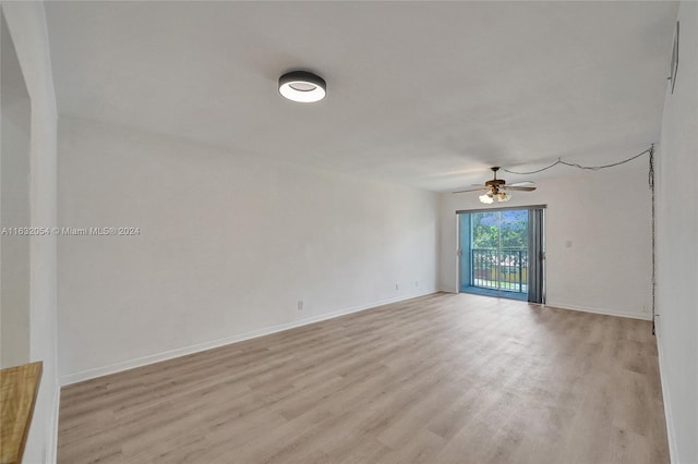 spare room featuring ceiling fan and light wood-type flooring