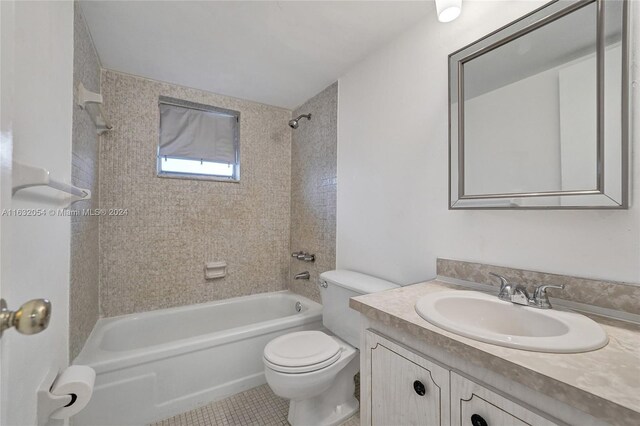 full bathroom featuring vanity, toilet, tiled shower / bath, and tile patterned flooring