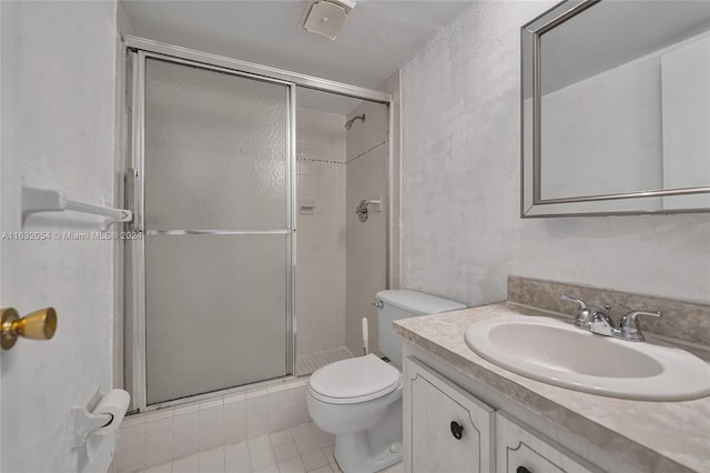 bathroom with walk in shower, tile patterned floors, toilet, and vanity