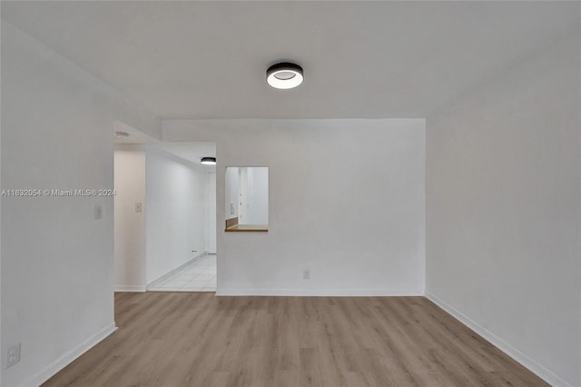 unfurnished room featuring light hardwood / wood-style floors