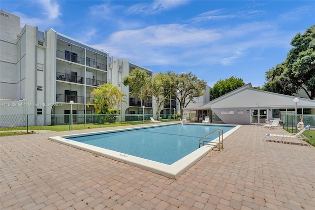 view of swimming pool with a patio