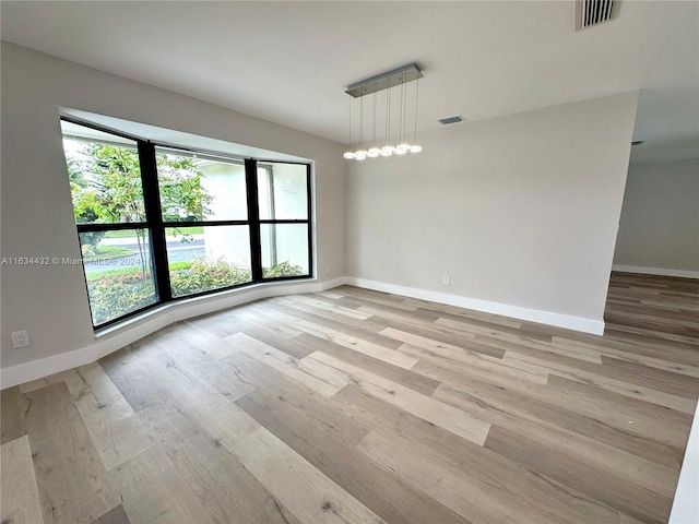 empty room with light wood-type flooring