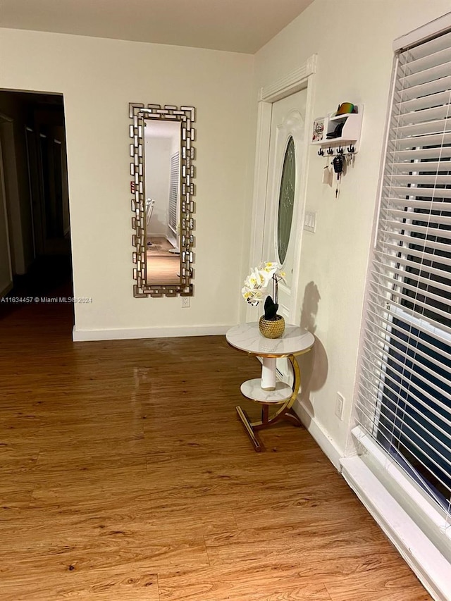 corridor featuring hardwood / wood-style flooring