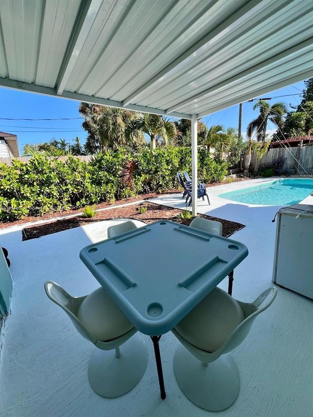 view of swimming pool featuring a patio area