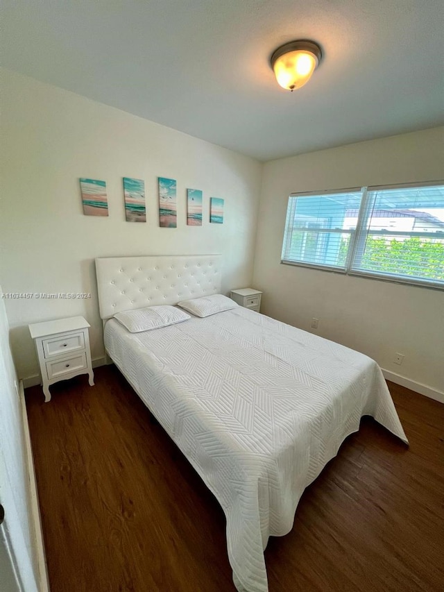 bedroom featuring dark hardwood / wood-style floors