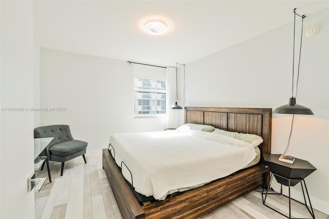 bedroom featuring light wood-type flooring