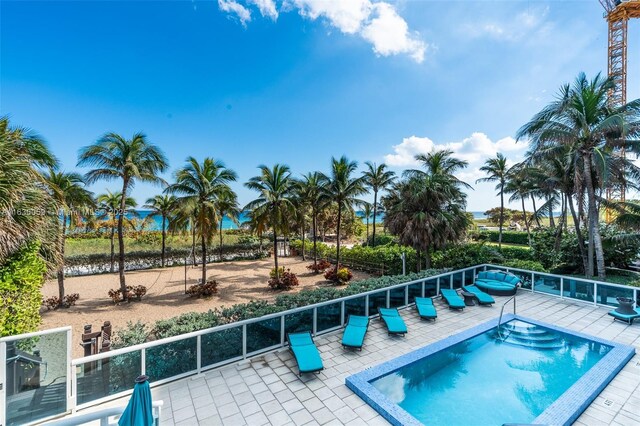 view of swimming pool with a patio area