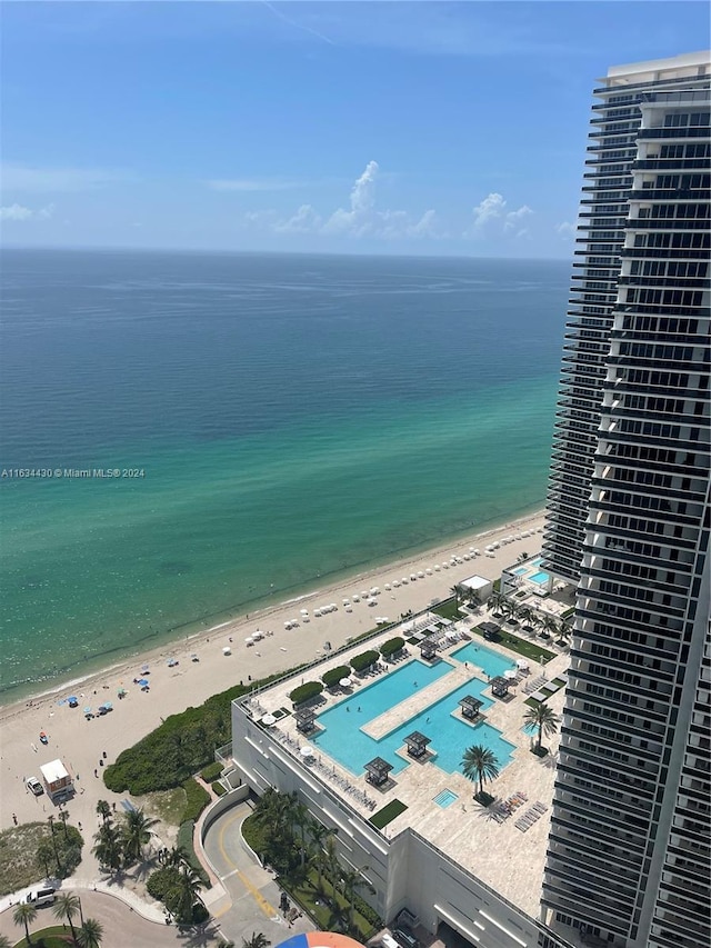 aerial view featuring a water view and a view of the beach