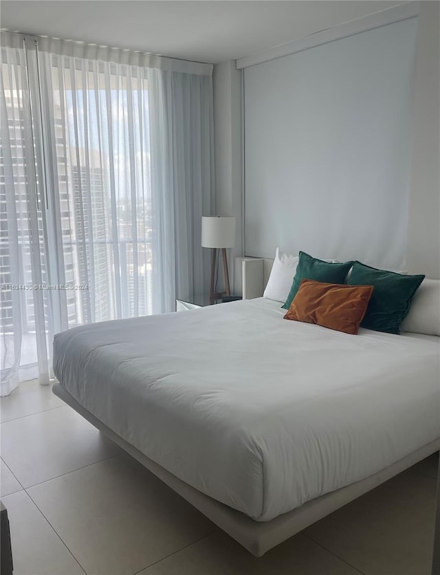 bedroom featuring light tile patterned floors