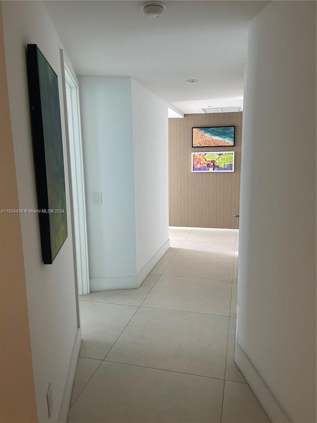 corridor with light tile patterned floors