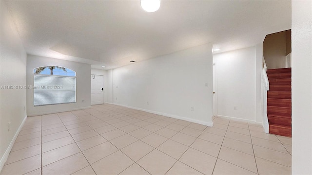 empty room featuring light tile patterned floors