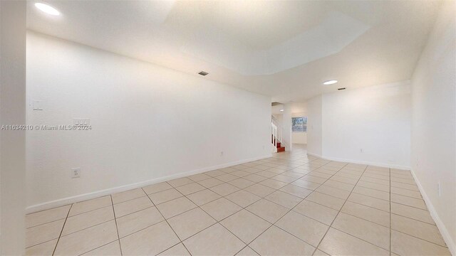 spare room with light tile patterned floors