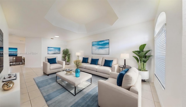 tiled living room with a tray ceiling