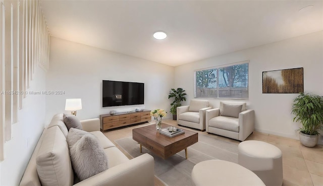 living room with light tile patterned flooring