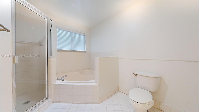 bathroom with toilet, separate shower and tub, and tile patterned flooring