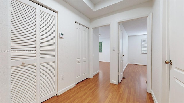 corridor featuring light hardwood / wood-style flooring