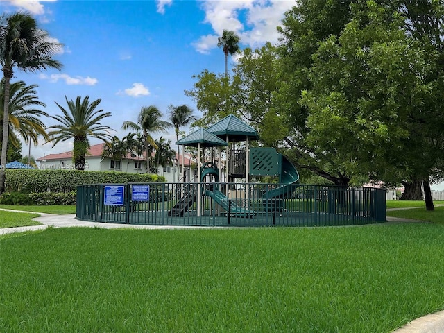 view of jungle gym featuring a lawn