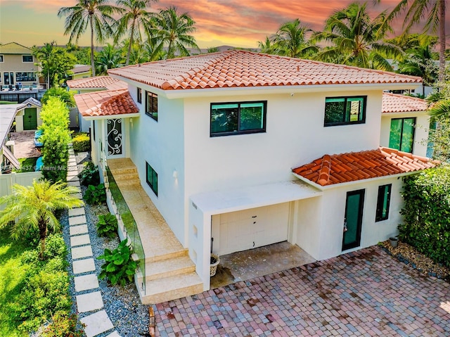 mediterranean / spanish-style house featuring a garage