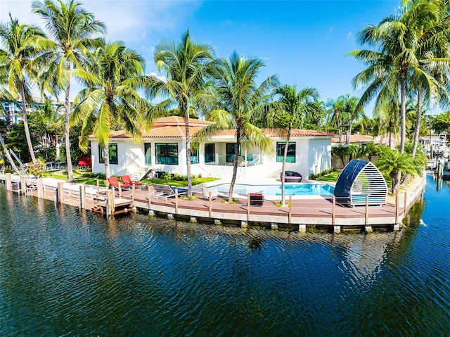 back of house featuring a water view