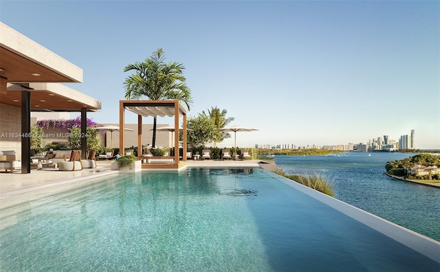 view of pool with a water view, a city view, an infinity pool, and a patio area