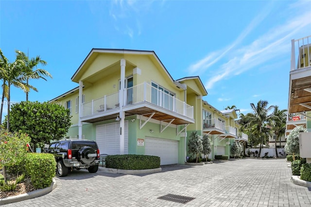 view of front of house with a balcony and a garage