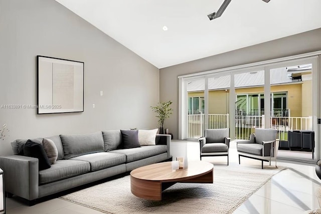 living room with tile patterned floors and high vaulted ceiling