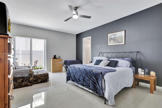 tiled bedroom with ceiling fan