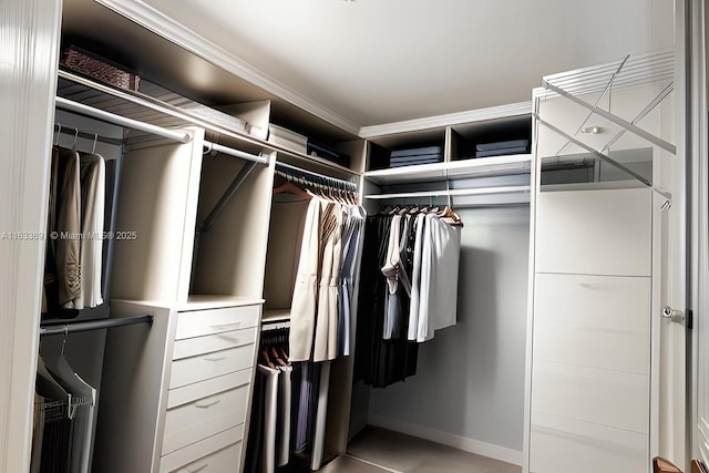 spacious closet featuring light tile patterned floors