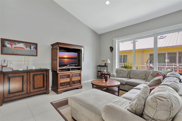 tiled living room featuring high vaulted ceiling