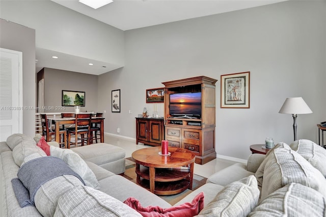 living room featuring a high ceiling