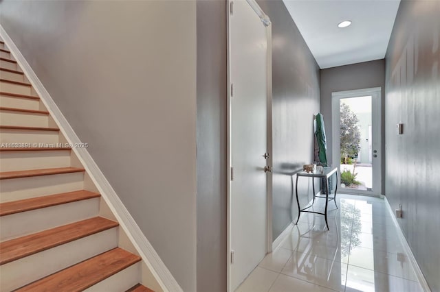 interior space featuring tile patterned floors, recessed lighting, and baseboards