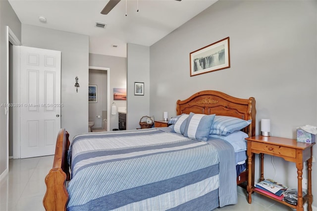 bedroom with ceiling fan and ensuite bath