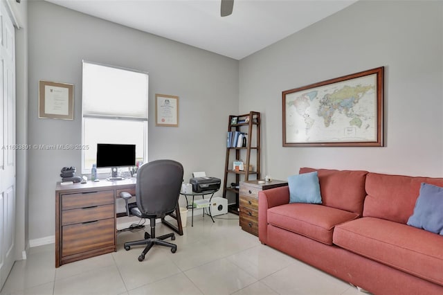 tiled office featuring ceiling fan