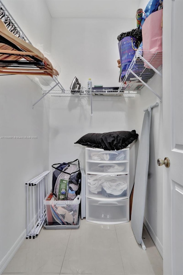 spacious closet featuring tile patterned floors