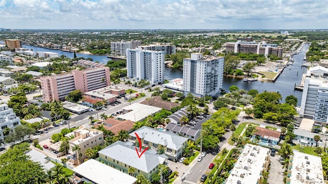 birds eye view of property featuring a water view and a view of city