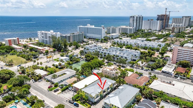 birds eye view of property with a water view