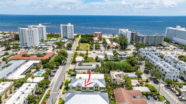 bird's eye view featuring a water view and a view of city