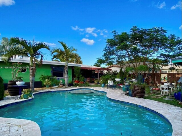 view of pool featuring a patio