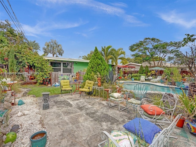 view of patio with a fenced in pool