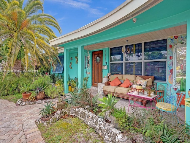 doorway to property with an outdoor hangout area