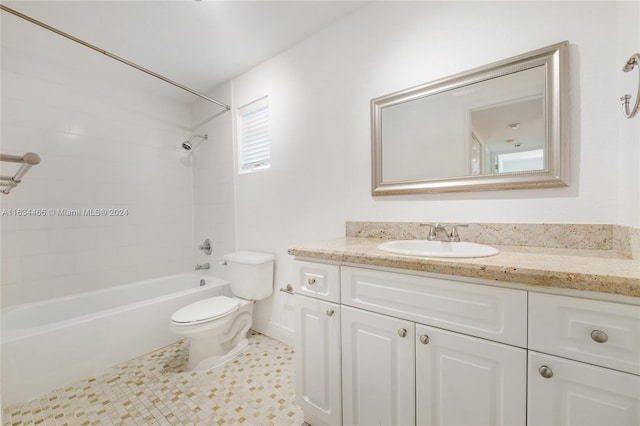 full bathroom featuring tile patterned flooring, vanity, toilet, and tiled shower / bath