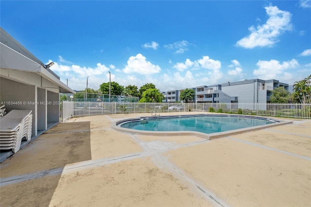 view of swimming pool featuring a patio