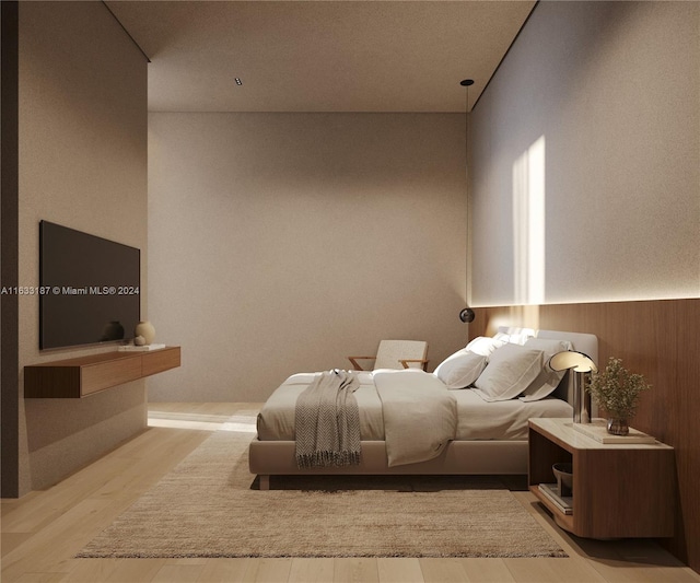 bedroom featuring hardwood / wood-style floors