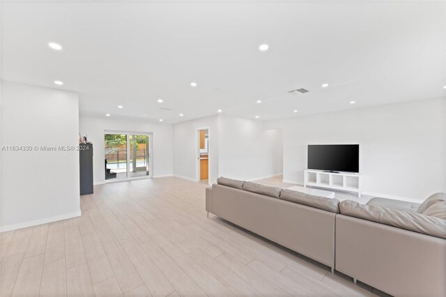 unfurnished living room featuring light hardwood / wood-style floors