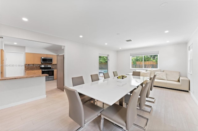 dining room with light wood-type flooring