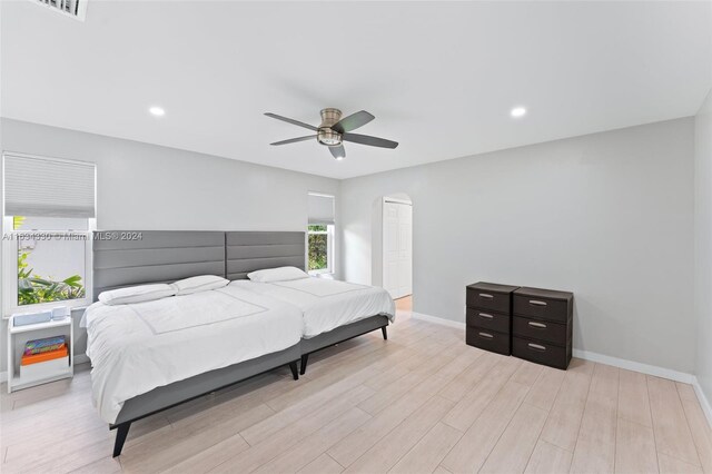 bedroom featuring ceiling fan and light hardwood / wood-style floors