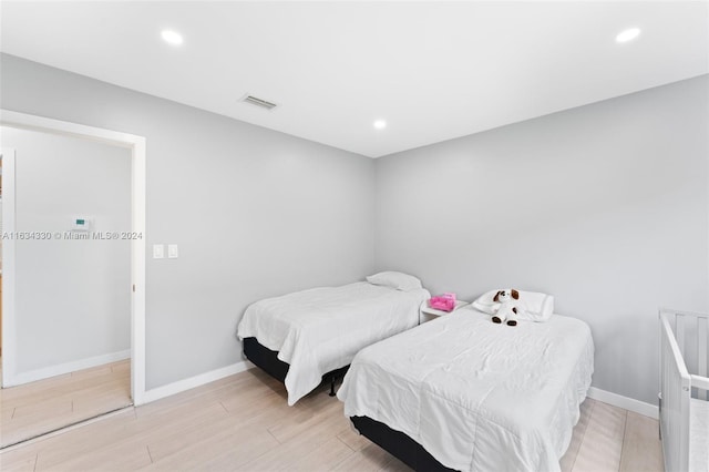 bedroom featuring light wood-type flooring