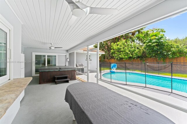 view of swimming pool with a grill, a hot tub, a patio area, and ceiling fan