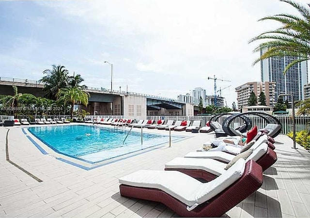 view of swimming pool featuring a patio area