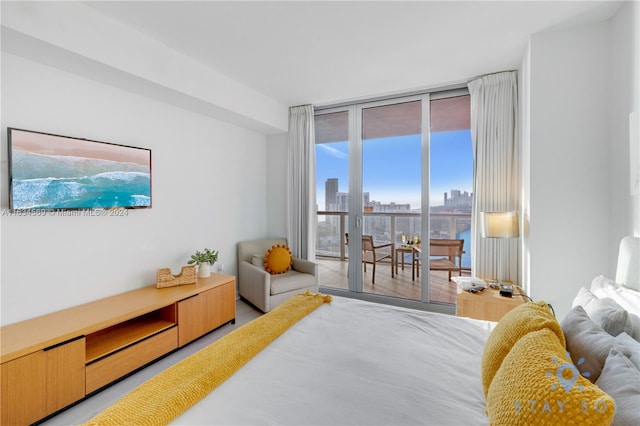 bedroom with access to exterior and floor to ceiling windows